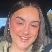 Headshot of Ella Dawkes.